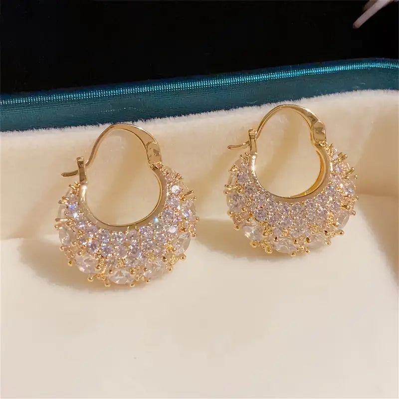 Elegant and luxurious 14K gold-plated earrings set with shiny Zirconia -.