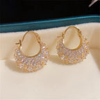 Elegant and luxurious 14K gold-plated earrings set with shiny Zirconia -.