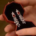 Pair of Elegant White Golden Zirconia Stud Earrings for Women.