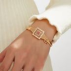 Vintage Dubai-Inspired Golden-Tone Copper Bracelet with Pinkish-Red Cubic Synthetic Zirconia Stones.