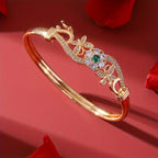 legant Golden-Tone Butterfly Open Bangle Bracelet with Sparkling Synthetic Zirconia & Floral Design.