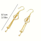 Elegant Golden Geometric Tassel Earrings with Sparkling Cubic Zirconia.