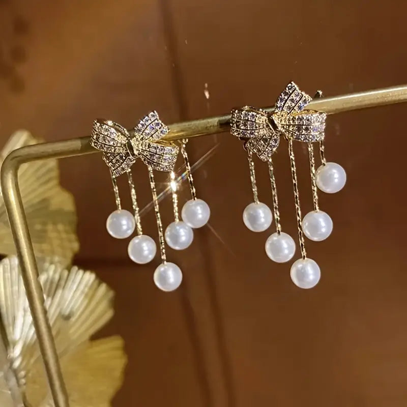 Faux Pearl Tassel Bow Decor Stud Earrings.