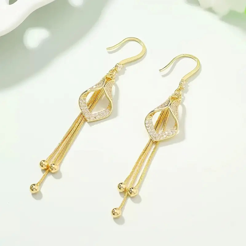 Elegant Golden Geometric Tassel Earrings with Sparkling Cubic Zirconia.