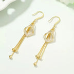 Elegant Golden Geometric Tassel Earrings with Sparkling Cubic Zirconia.