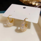 Elegant and luxurious 14K gold-plated earrings set with shiny Zirconia -.