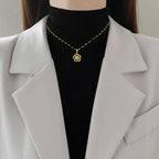 Stainless Steel Golden-Plated Micro-Set Synthetic Zirconia & Rotating Floral Pendant Necklace.