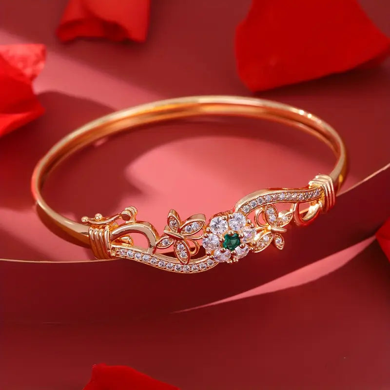 legant Golden-Tone Butterfly Open Bangle Bracelet with Sparkling Synthetic Zirconia & Floral Design.