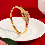 Vintage Dubai-Inspired Golden-Tone Copper Bracelet with Pinkish-Red Cubic Synthetic Zirconia Stones.