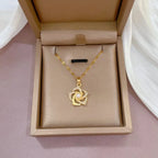 Stainless Steel Golden-Plated Micro-Set Synthetic Zirconia & Rotating Floral Pendant Necklace.