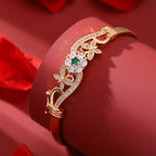 legant Golden-Tone Butterfly Open Bangle Bracelet with Sparkling Synthetic Zirconia & Floral Design.