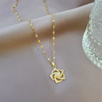 Stainless Steel Golden-Plated Micro-Set Synthetic Zirconia & Rotating Floral Pendant Necklace.