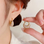 Elegant and luxurious 14K gold-plated earrings set with shiny Zirconia -.