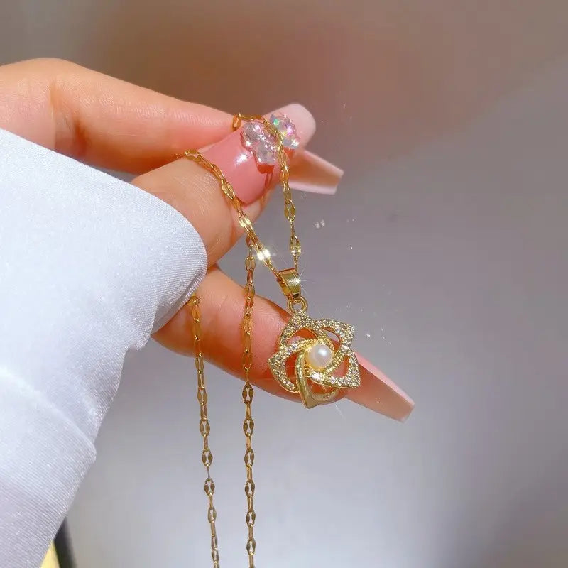 Stainless Steel Golden-Plated Micro-Set Synthetic Zirconia & Rotating Floral Pendant Necklace.
