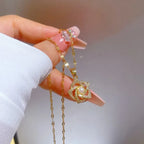 Stainless Steel Golden-Plated Micro-Set Synthetic Zirconia & Rotating Floral Pendant Necklace.